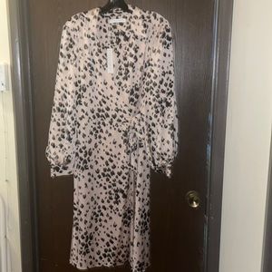 Trina Turk Size 10 brand new creme wrap dress. Still has tags.